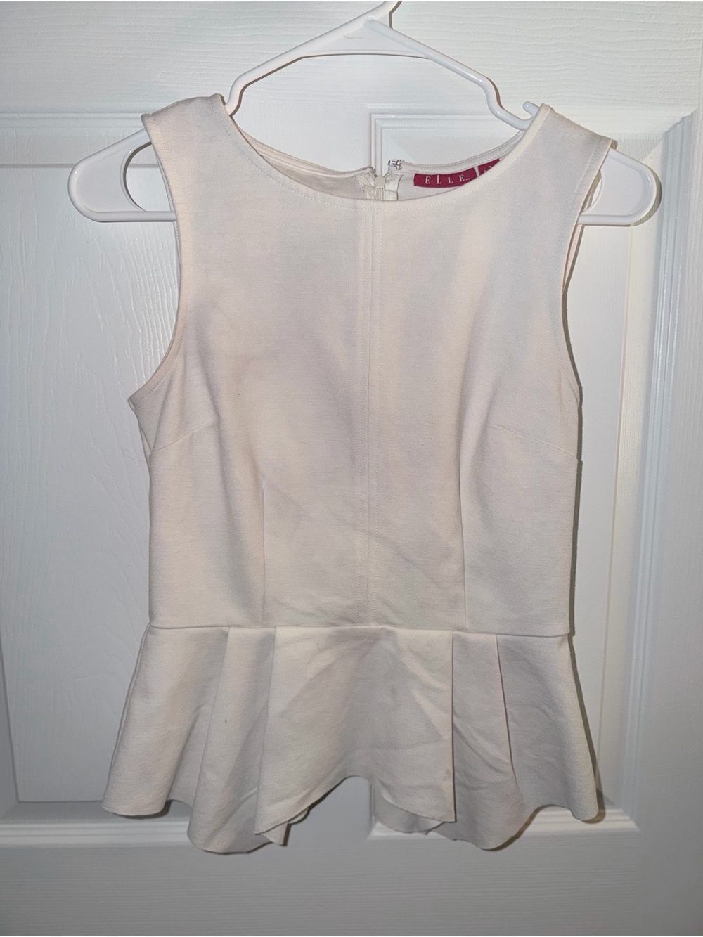 Elle Sleeveless Peplum Top in White